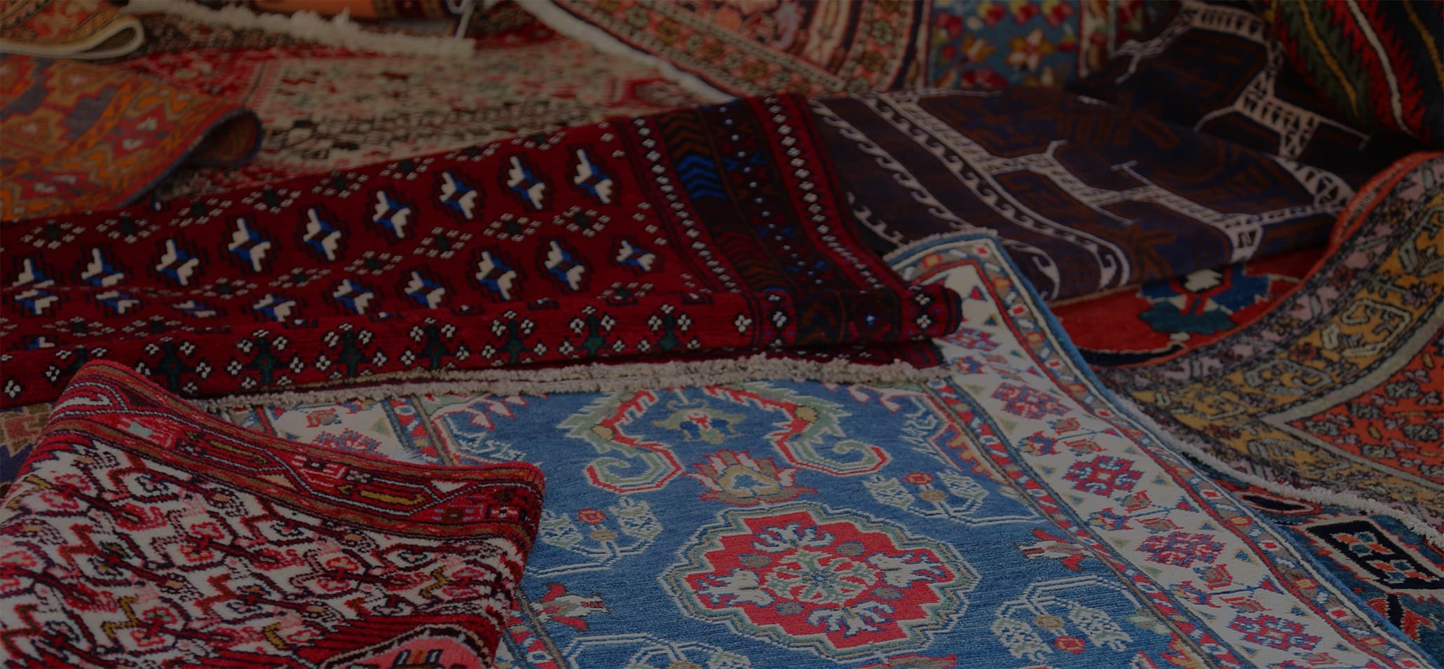 Close-up of an oriental rug showing intricate weave and fringe detail